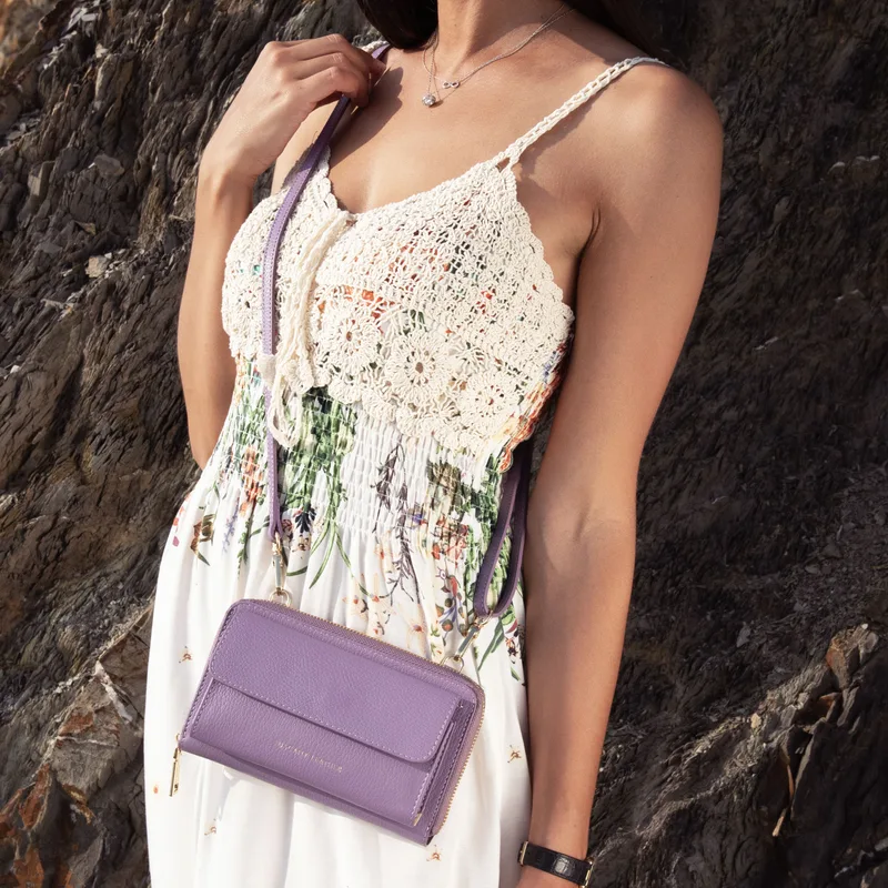 Woman wearing a Tuscany Leather crossbody bag
