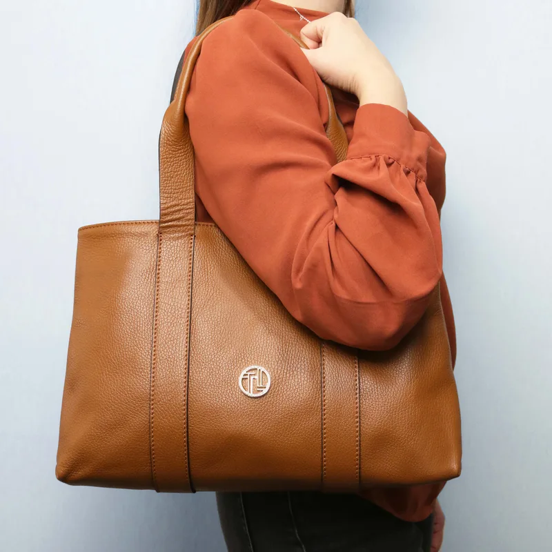 Woman with a soft Tuscany Leather shoulder bag